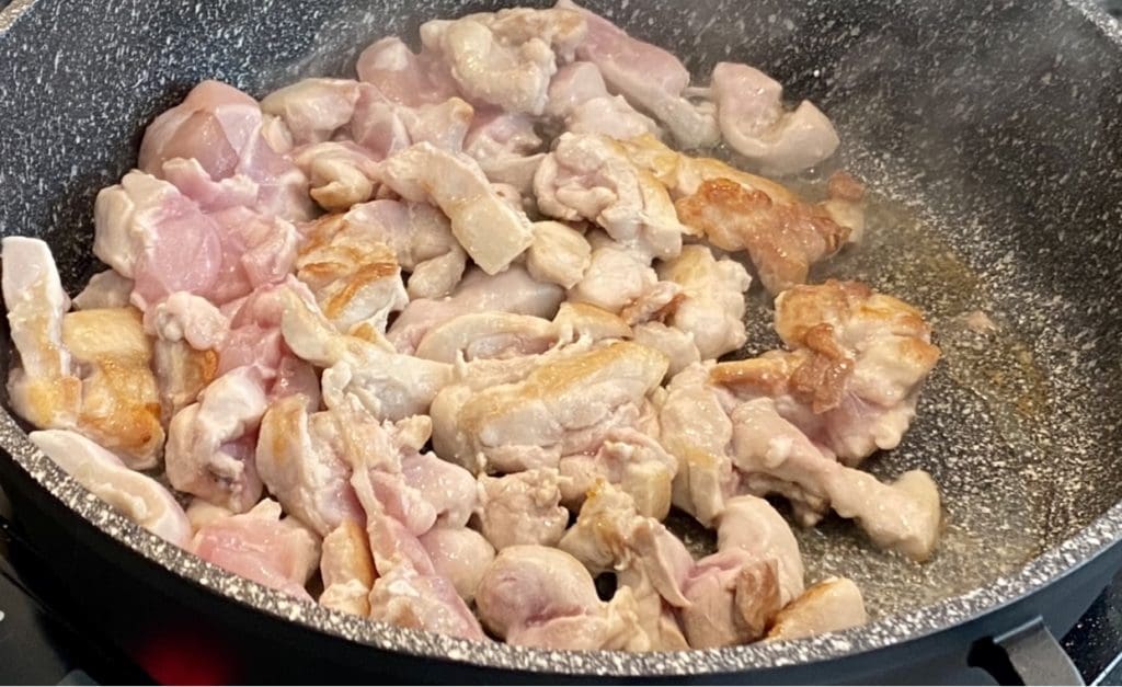 browning the chicken in the pan