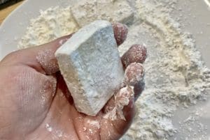 coating the tofu in flour