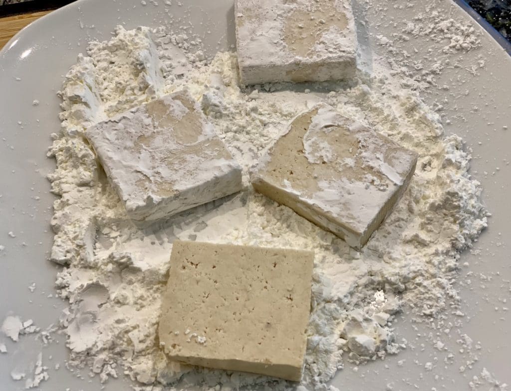 coating the tofu in flour