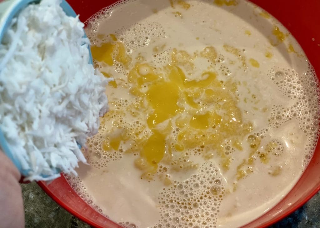 mixing the chia mango coconut pudding