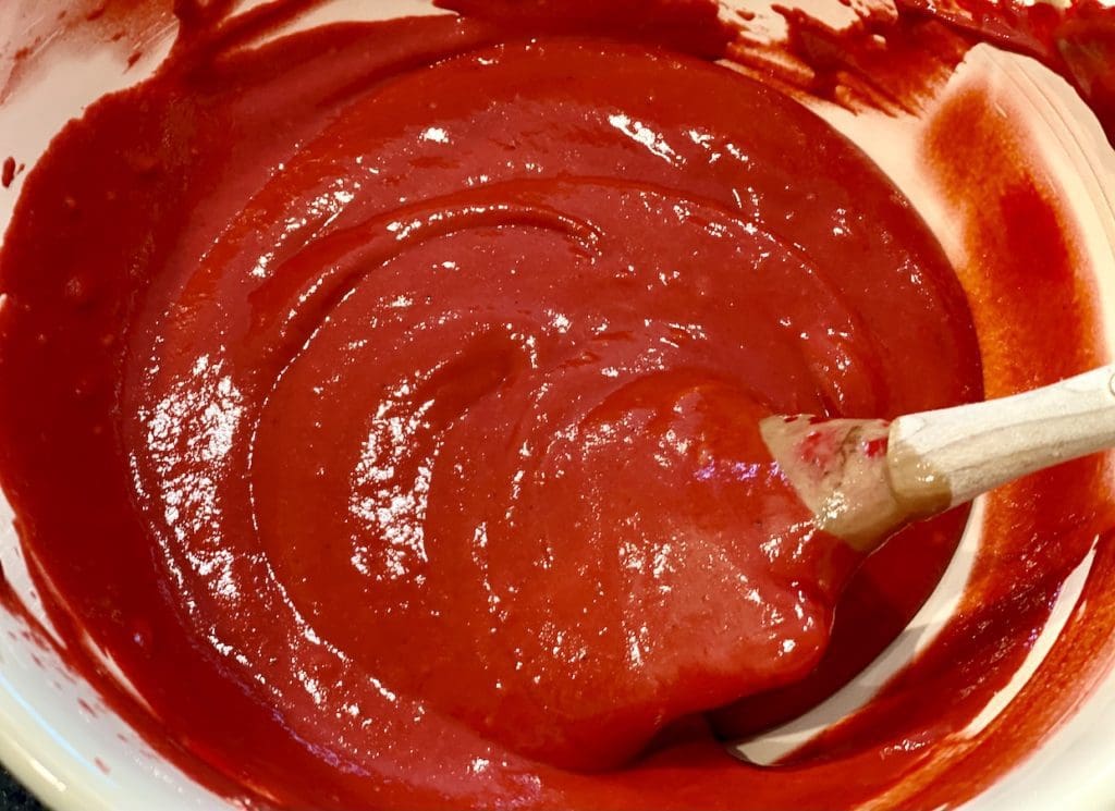 mixing red colouring into batter