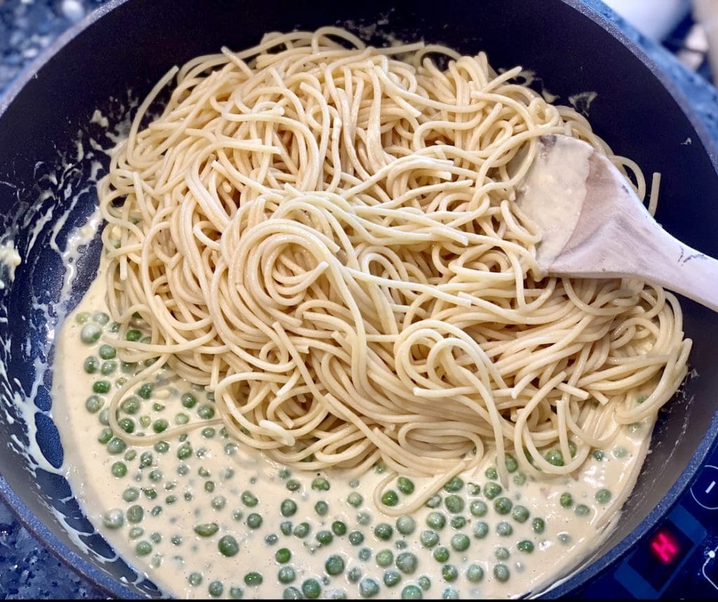 adding ingredients to the sauce