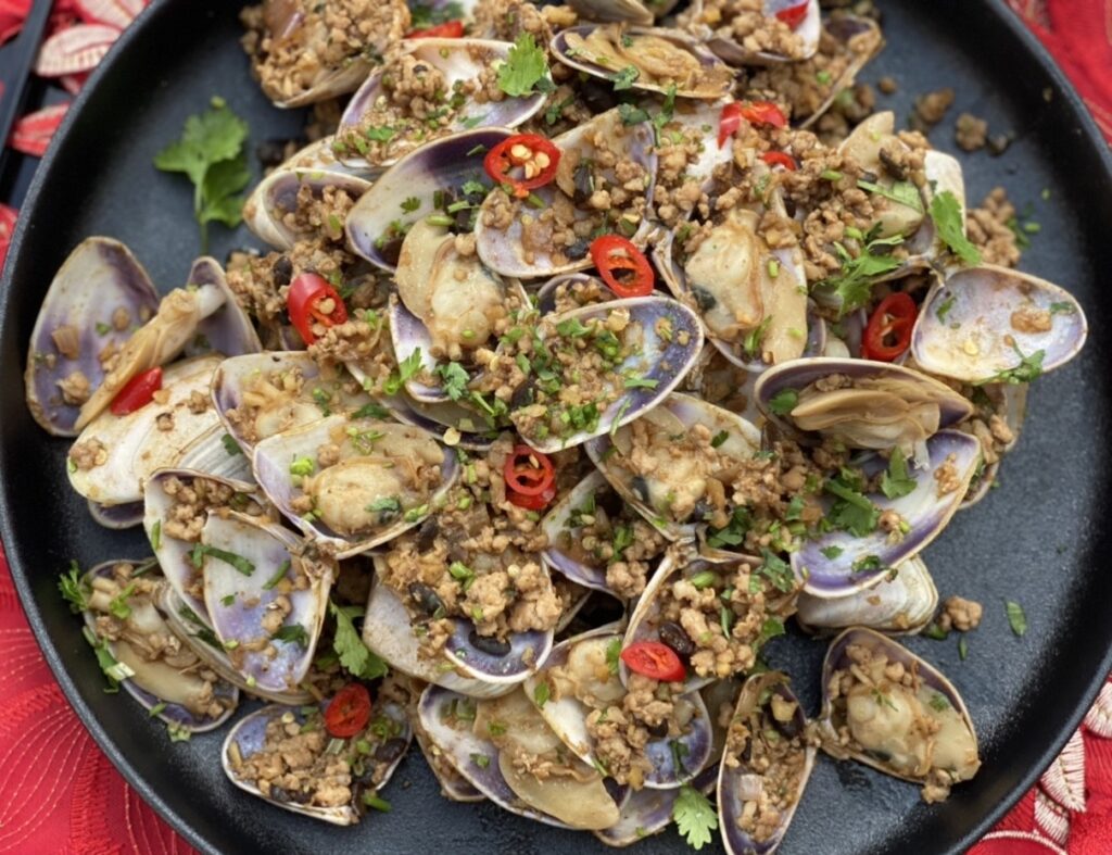 Chinese Pork and clams Chinese with minced pork, chilli slices, and fresh coriander