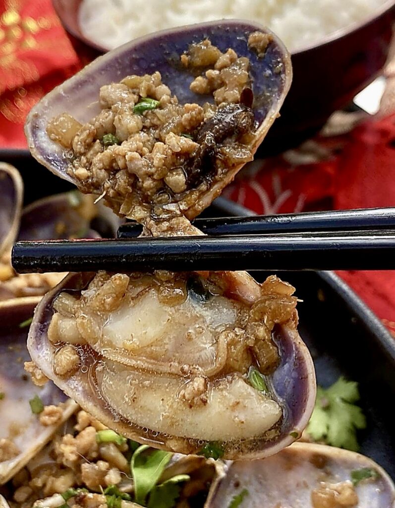 Close-up of Chinese pork and clams showing juicy clam meat and savoury pork mince