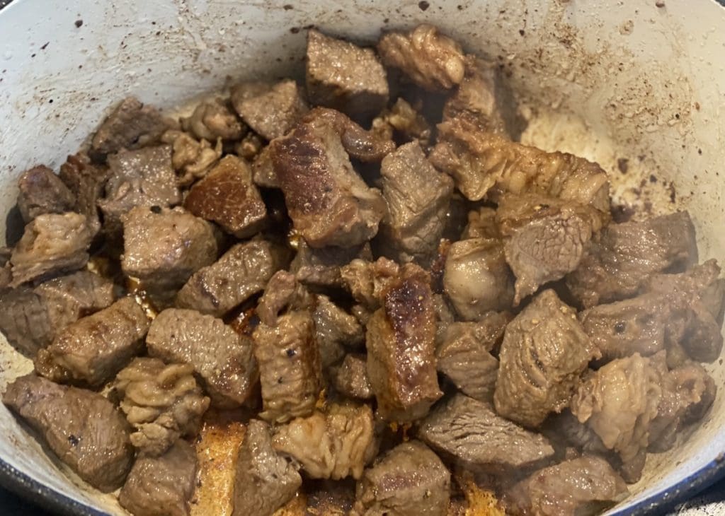 Beef browning in a Dutch oven until it develops a nice crust before adding into stew