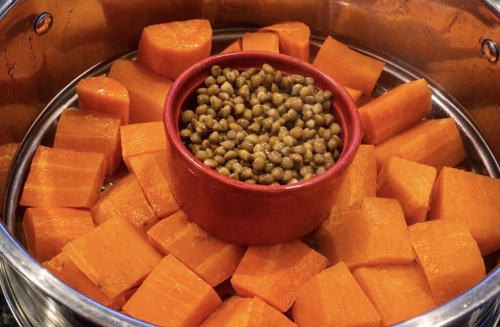 Lentils and sweet potato steamed together to make lentils for baby meal