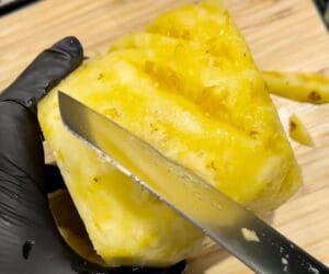 peeling pineapple