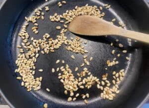 toasting the pine nuts