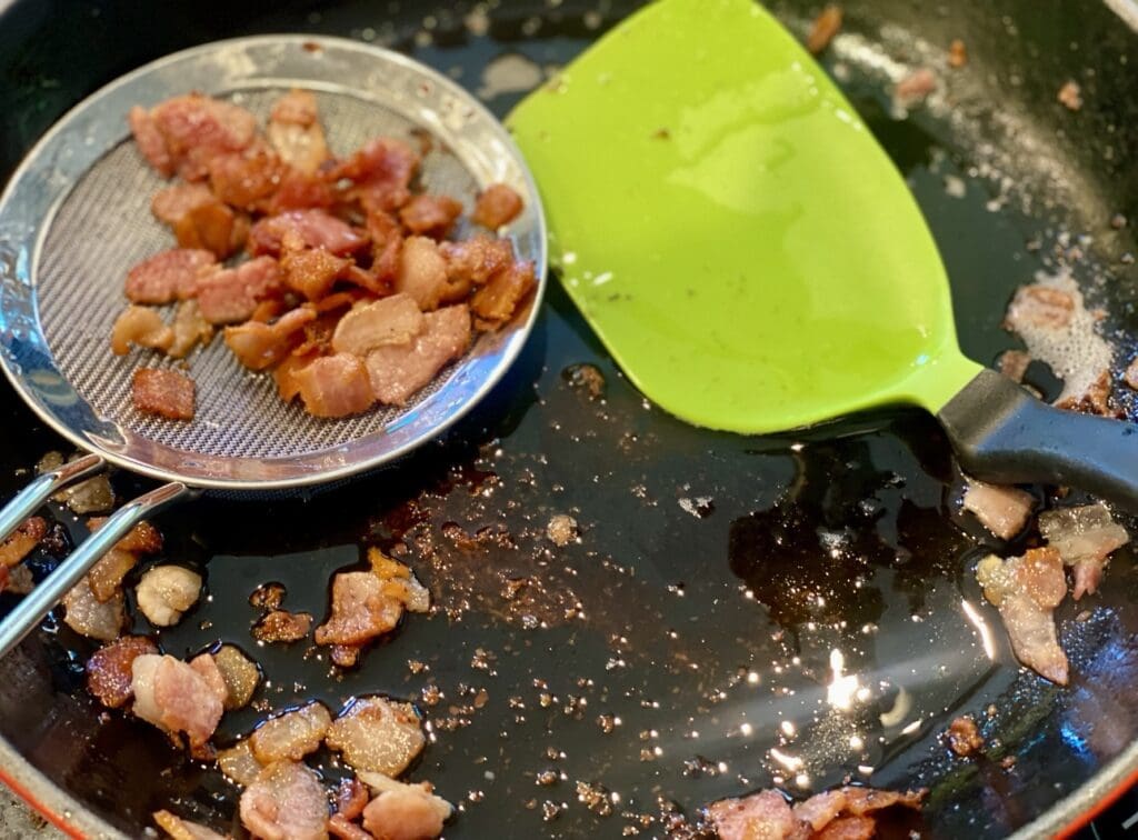 frying the bacon until crispy