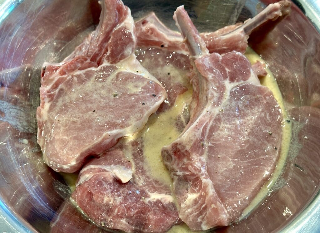 marinating the pork chops
