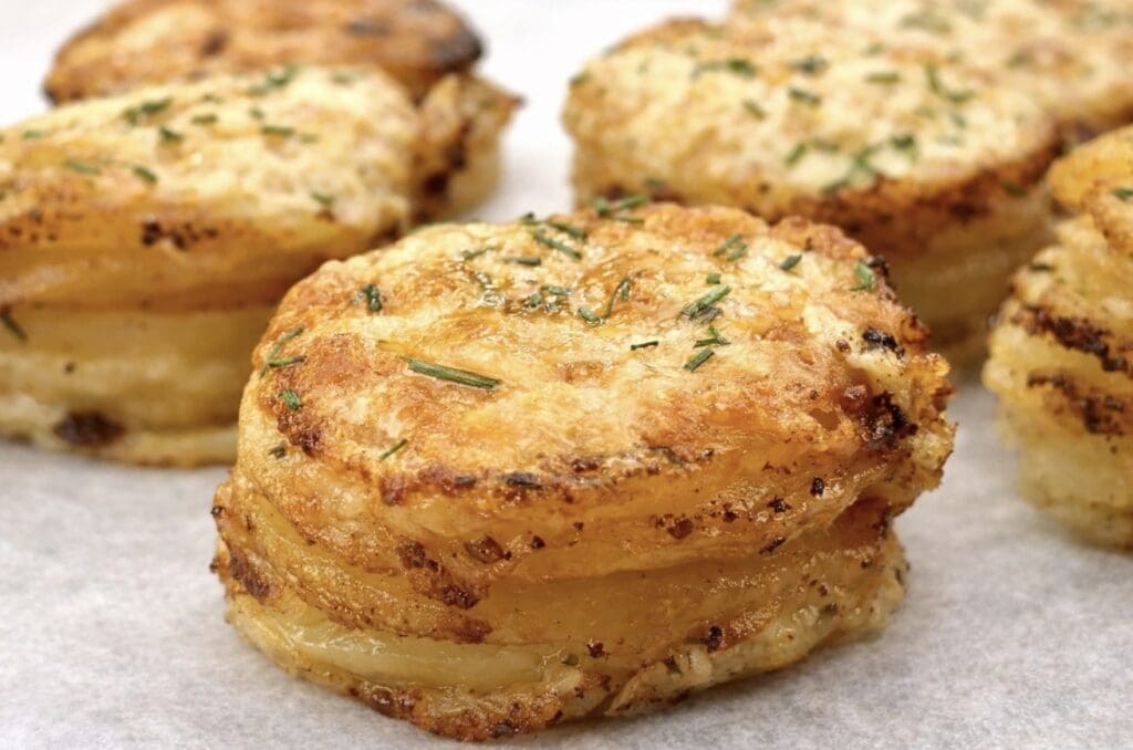 Close up of the Potato Stacks looks golden and creamy, with a generous amount of melted cheese on top