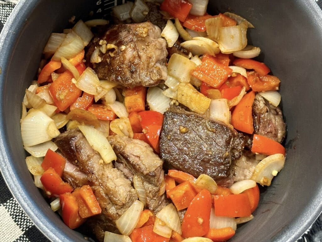 placing all ingredients in slow cooker