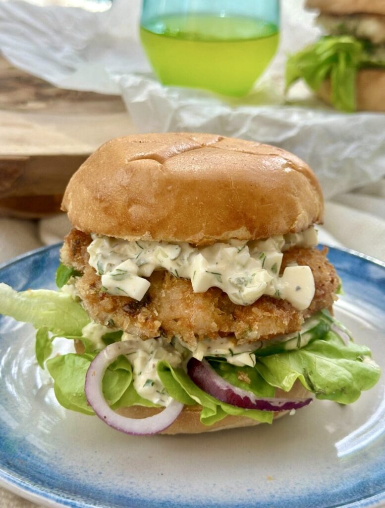 Homemade prawn burger stacked with crispy prawns, fresh salad and Japanese egg mayonnaise on a brioche bun