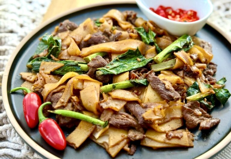 Pad see ew made with chewy flat rice noodles, sliced beef and Chinese broccoli with soy sauce