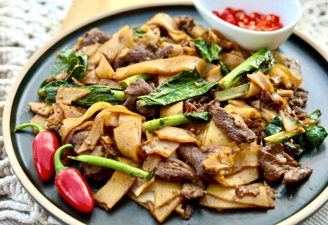 Pad see ew made with chewy flat rice noodles, sliced beef and Chinese broccoli with soy sauce