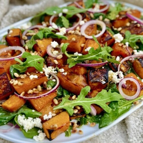 Honey roast pumpkin salad with baby spinach feta and pine nuts