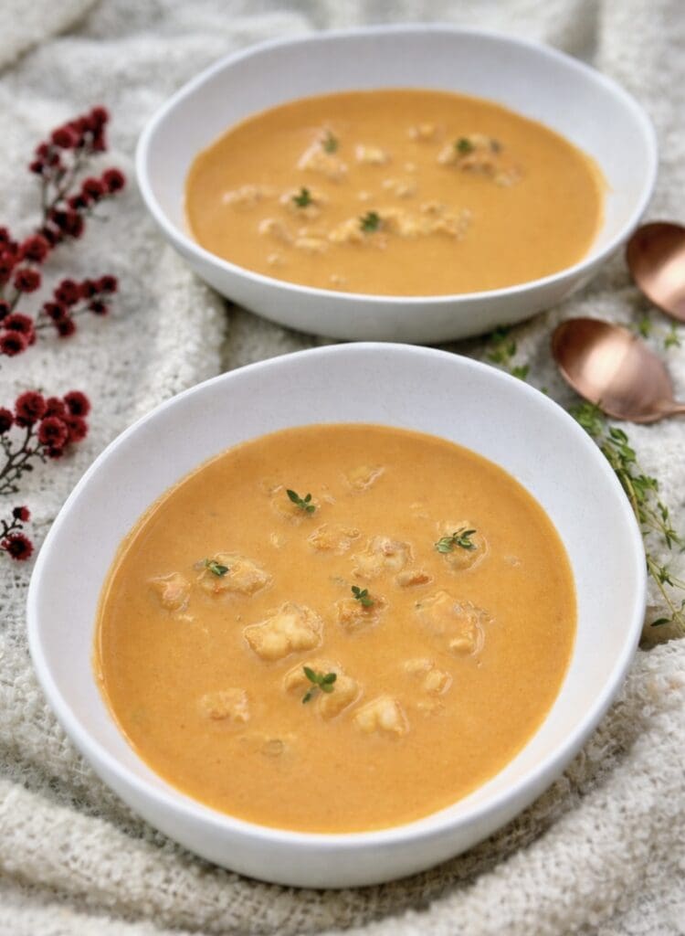 Homemade prawn bisque with big prawn flavour, creamy seafood soup garnished with thyme.