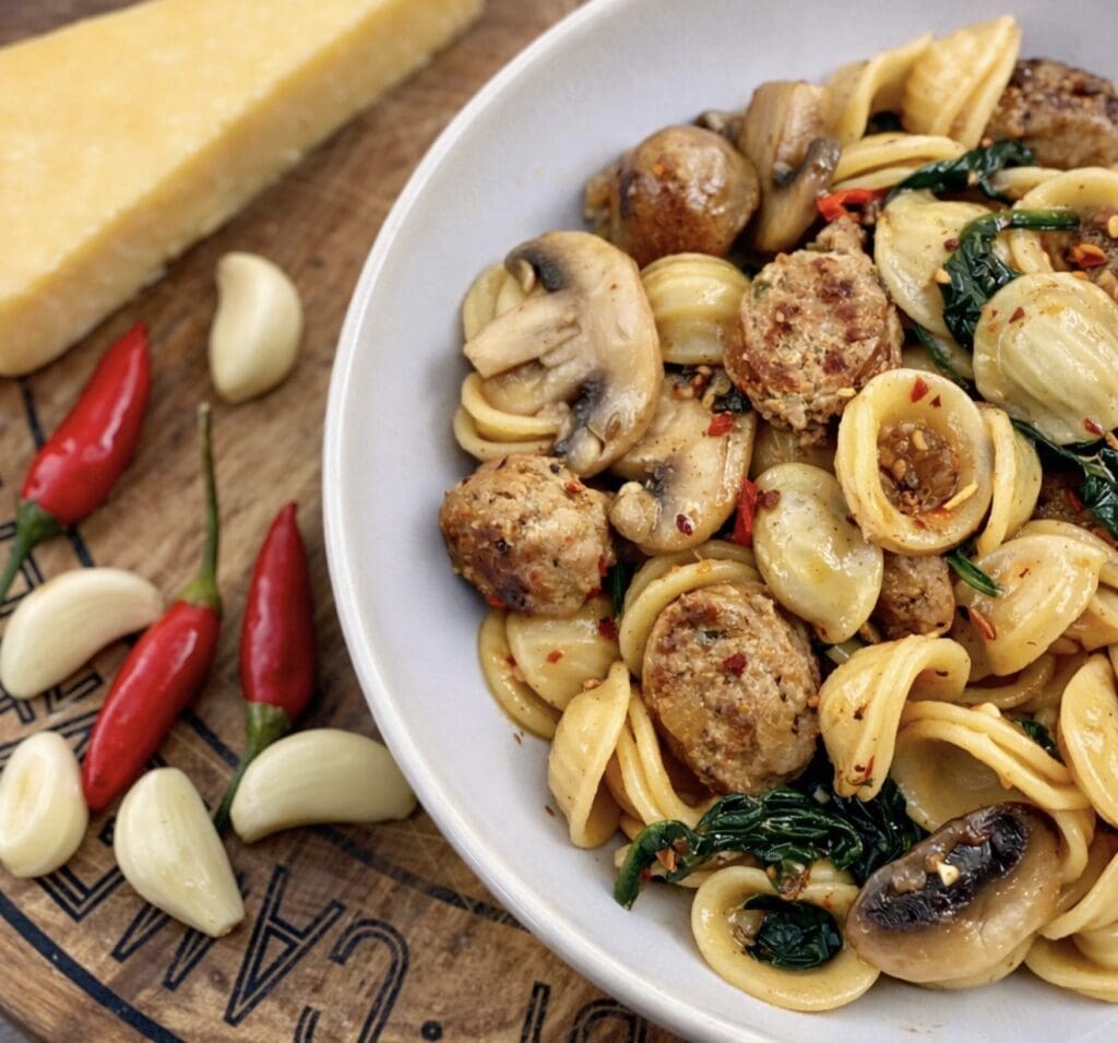 Orecchiette pasta with spicy Italian sausage, garlic, chilli and mushrooms, finished with parmesan