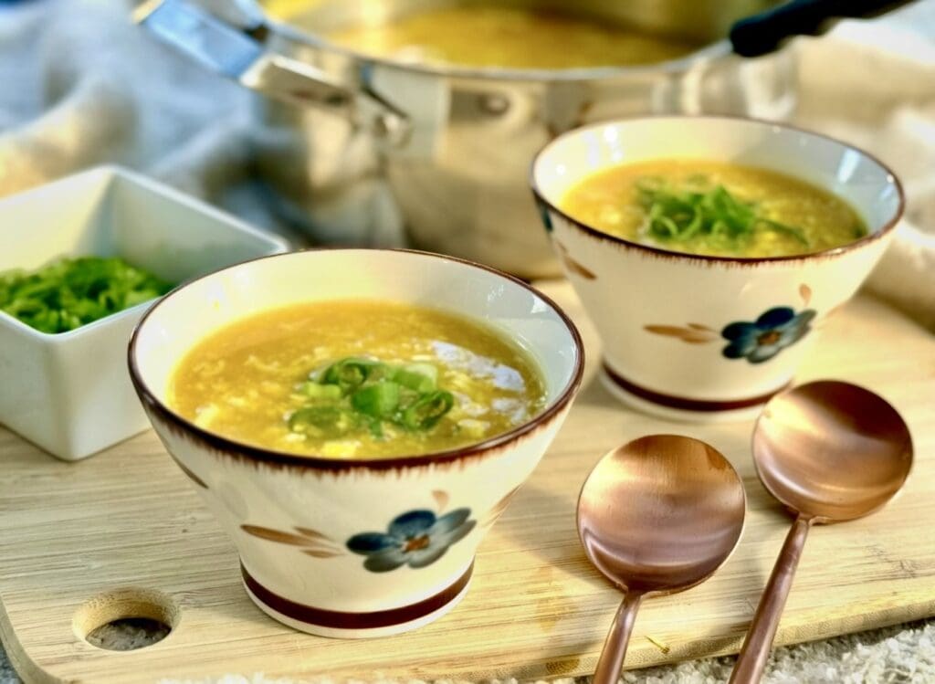 Warm homemade chicken and corn soup served in bowls