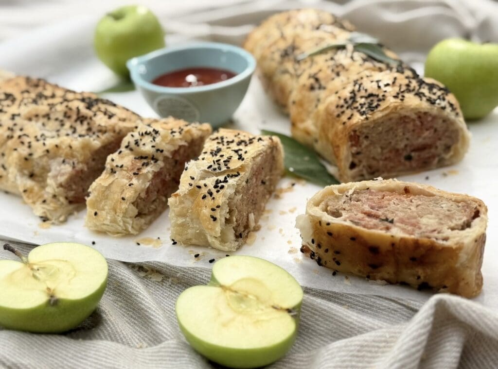 Pork and Apple Sausage Rolls displayed beautifully with dipping sauce