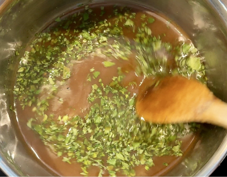 Heating up the marinade to make the serving sauce