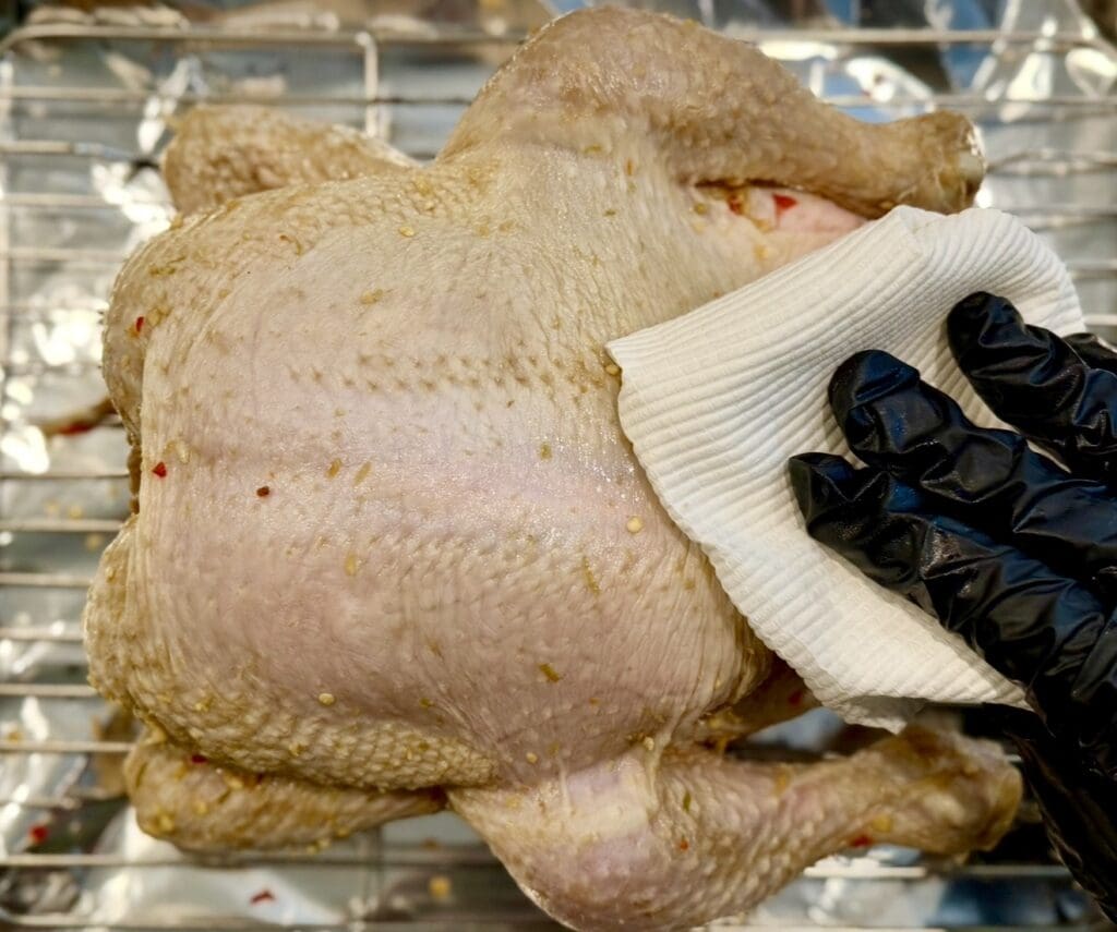 patting the chicken dry with paper towels