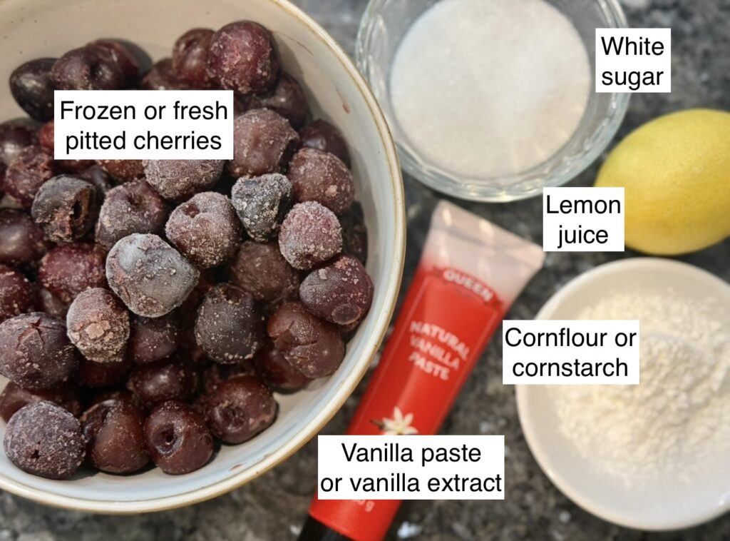 Ingredients displayed for cherry compote on a kitchen bench